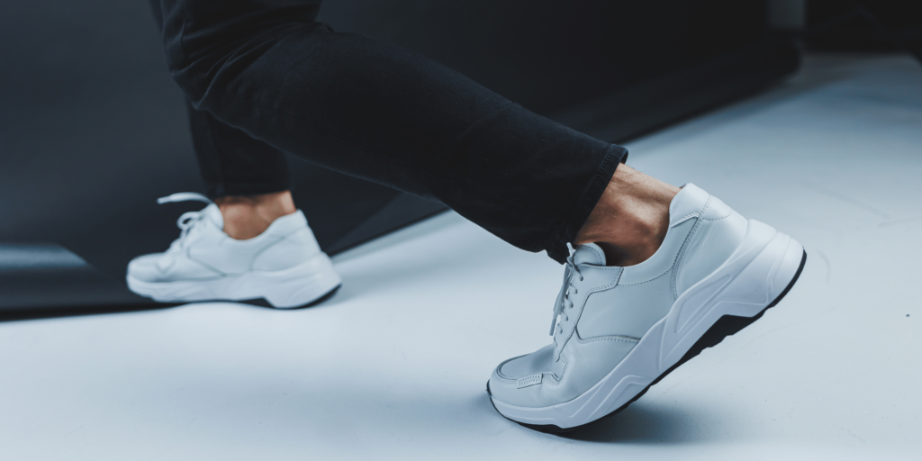 Modern white sneaker in a clean, sustainable design, emphasizing comfort and durability, with a focus on repairable components for eco-friendly fashion.