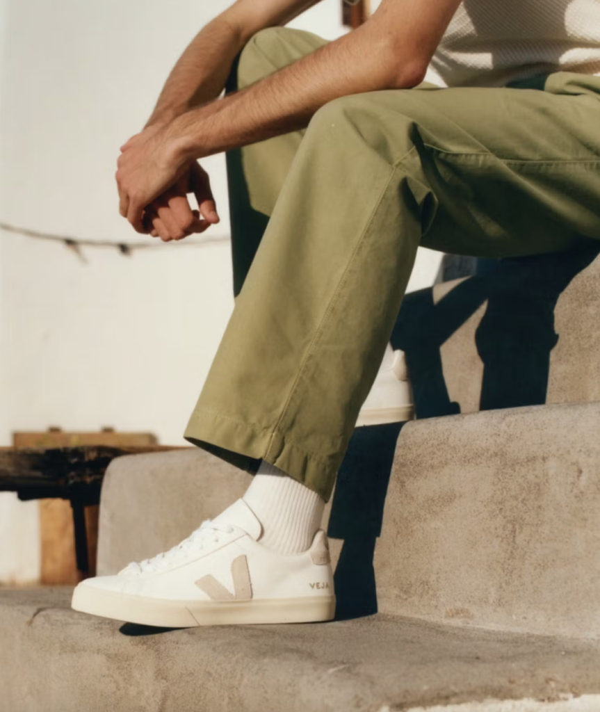 Veja sneakers displaying eco-innovative design with recyclable materials and repairable details, embodying ethical fashion for environmentally conscious consumers.