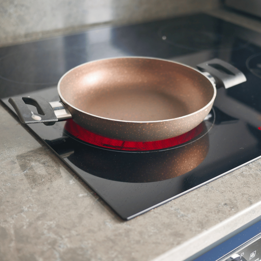 ceramic vs stainless steel cookware:  ceramic pan heating on a glass cookware top.  